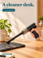 AirSweep with a brush attachment at a keyboard